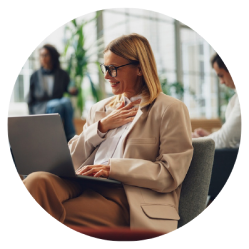 Smiling woman freelancer talking with client via video call sitting in coworking. High quality photo